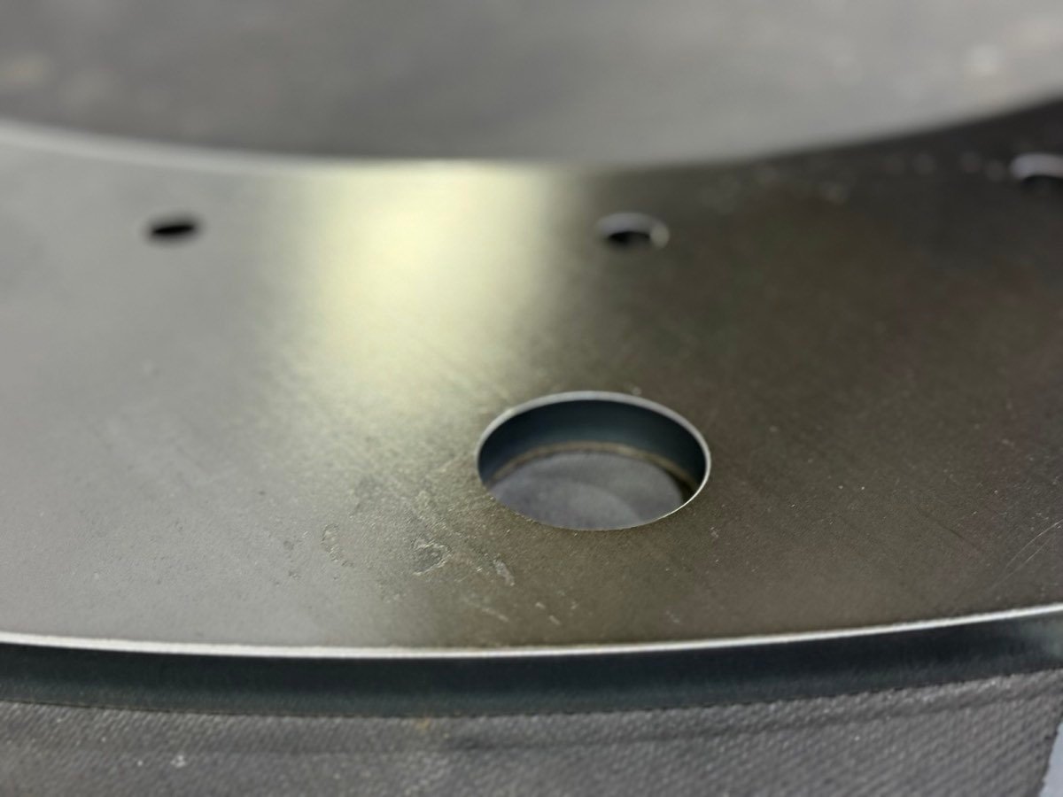 Close-up of a finished cut edge and countersunk hole