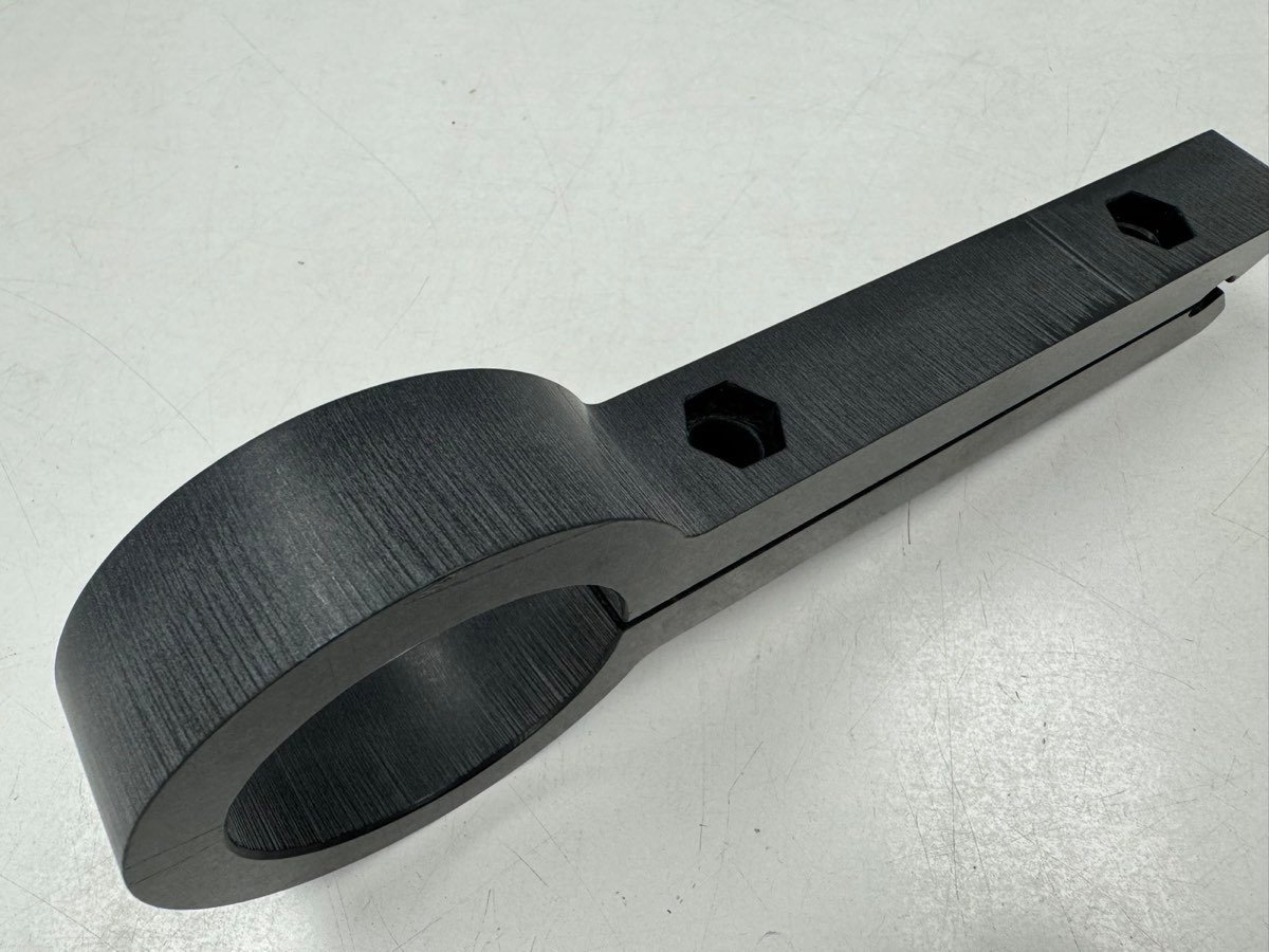 Deburred black bracket with clean machined edges at ACP
