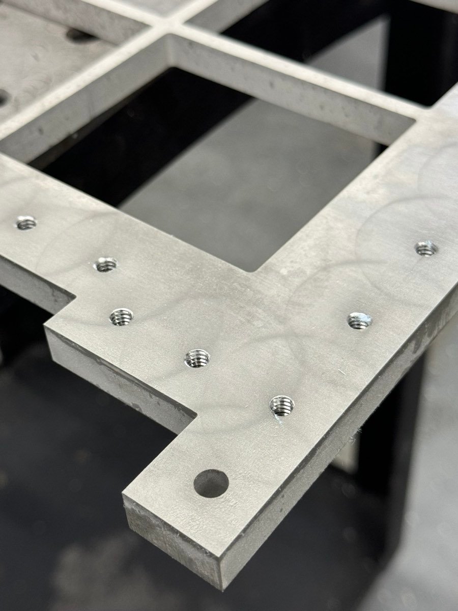 Waterjet-cut plate with in-house tapped holes at ACP